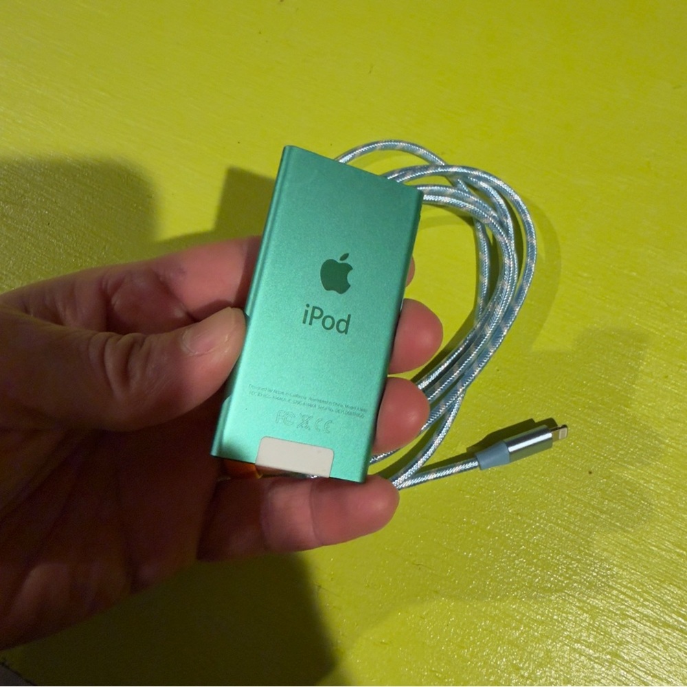 Apple iPod Nano in Aqua Green with blue USB C cable. 16GB. Read. 7th Gen